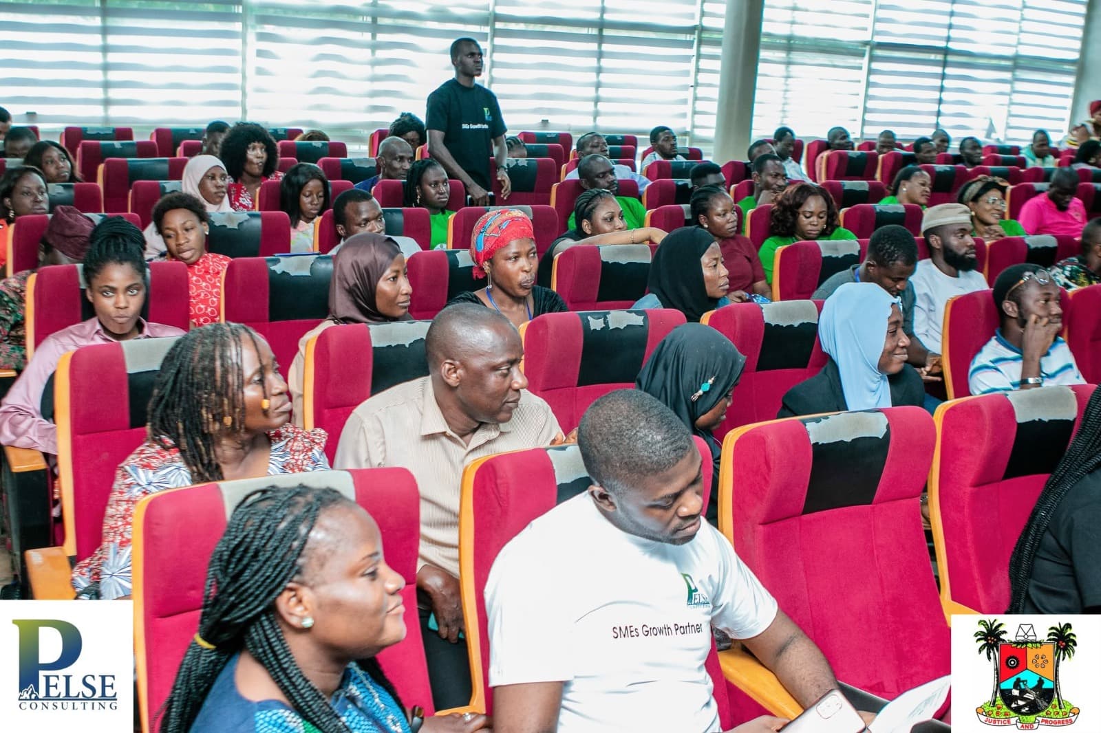 Full cohort seated in the auditorium during a Clinic training day