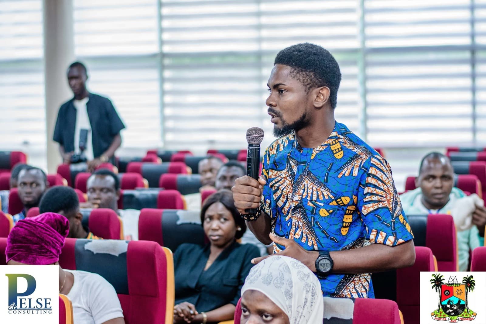 A participant asking a question during an open floor session
