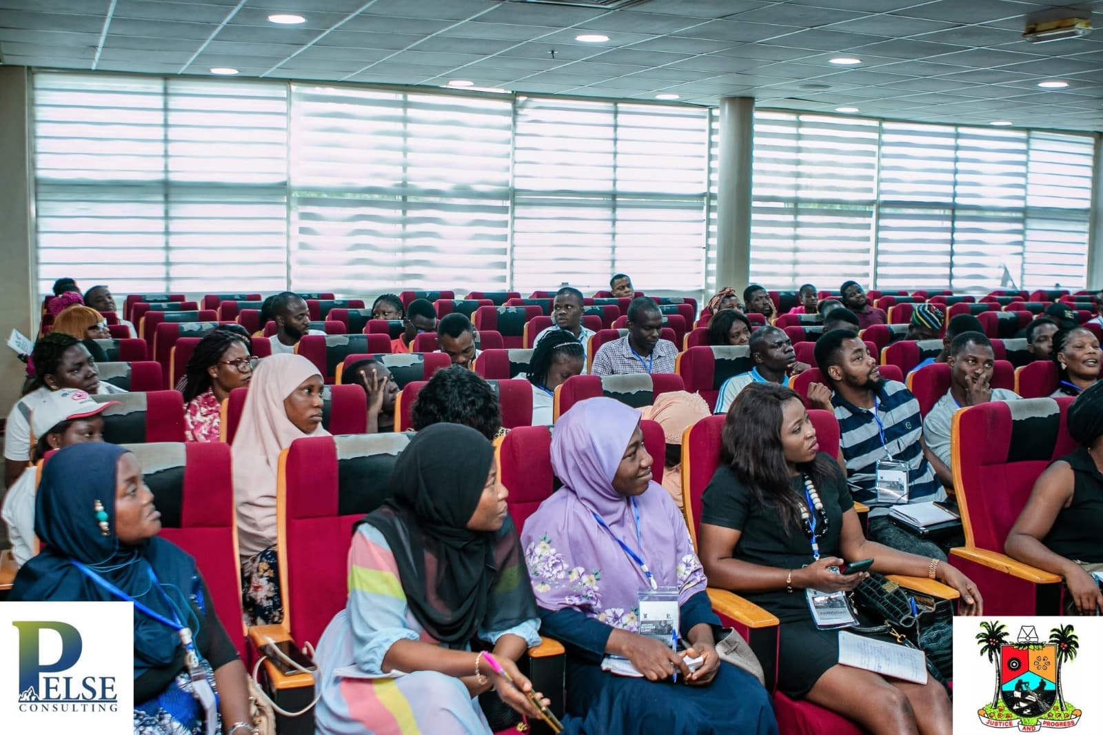 Participants seated in the training hall during a Clinic session